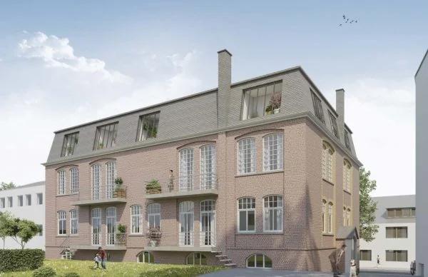 Historisches Backstein-Wohnhaus an der Schönen Aussicht mit Mansarddach und grüner Rasenfläche.